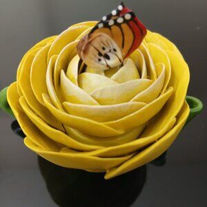 A yellow mini tea pot.